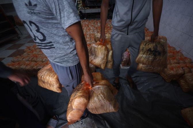 A bakery prepares rations of bread to pass out to displaced Palestinians in the Rafah refugee camp, in southern Gaza, on October 17.