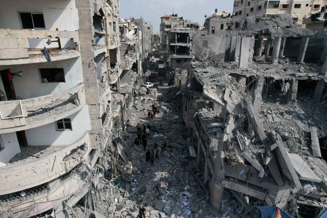 Palestinians look for survivors after an Israeli airstrike in Deir al-Balah, Gaza, on October 22.