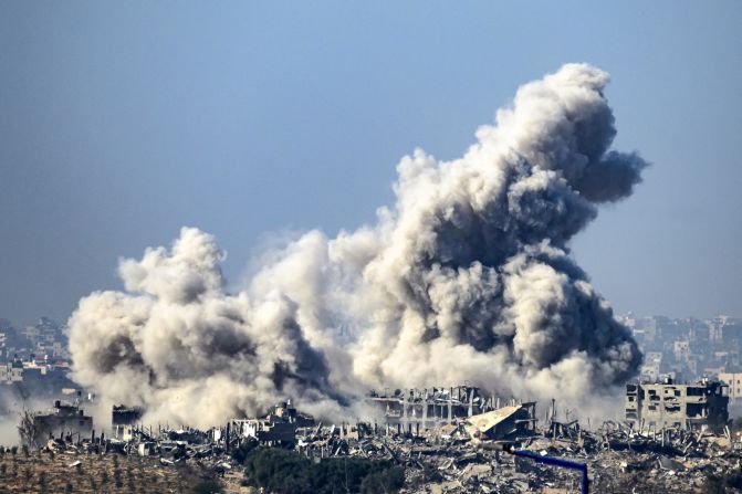 Smoke rises from buildings in Gaza after being hit by Israeli strikes as attacks resume between Israel and Hamas militants, on December 1.