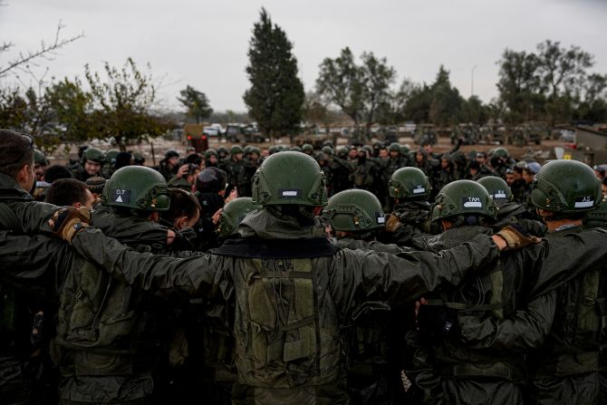 Israeli soldiers listen to their commander as they prepare to enter the Gaza Strip, near the Israeli-Gaza border, in southern Israel, on December 13.