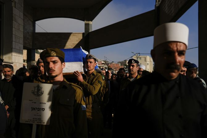 Israeli soldiers carry the flag-draped casket of Staff Sgt. Sufian Dagash during his funeral in the village of Maghar, northern Israel, on January 3.