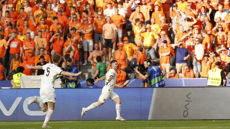 Austria's midfielder #18 Romano Schmid celebrates scoring his team's second goal with his teammates during the UEFA Euro 2024 Group D football match between the Netherlands and Austria at the Olympiastadion in Berlin on June 25, 2024.