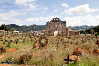 San Juan Chamula Mexico  May 10 2014 The cemetery and the San Sebastian Church of the Tzotzil village San Juan Chamula a...