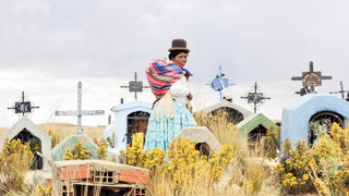 An Aymara woman walks at the Villa Ingenio cemetery in El Alto 25 Km west of La Paz on November 2 2011 during the...
