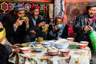 Mongolians sharing a meal