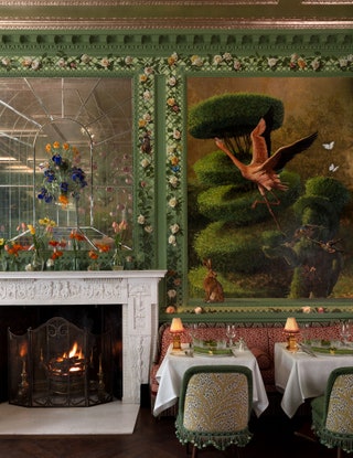 The fireplace and ornate wallpaper at Annabel's.