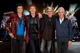 Image may contain Charlie Watts Mick Jagger Keith Richards Clothing Apparel Coat Jacket Human and Person