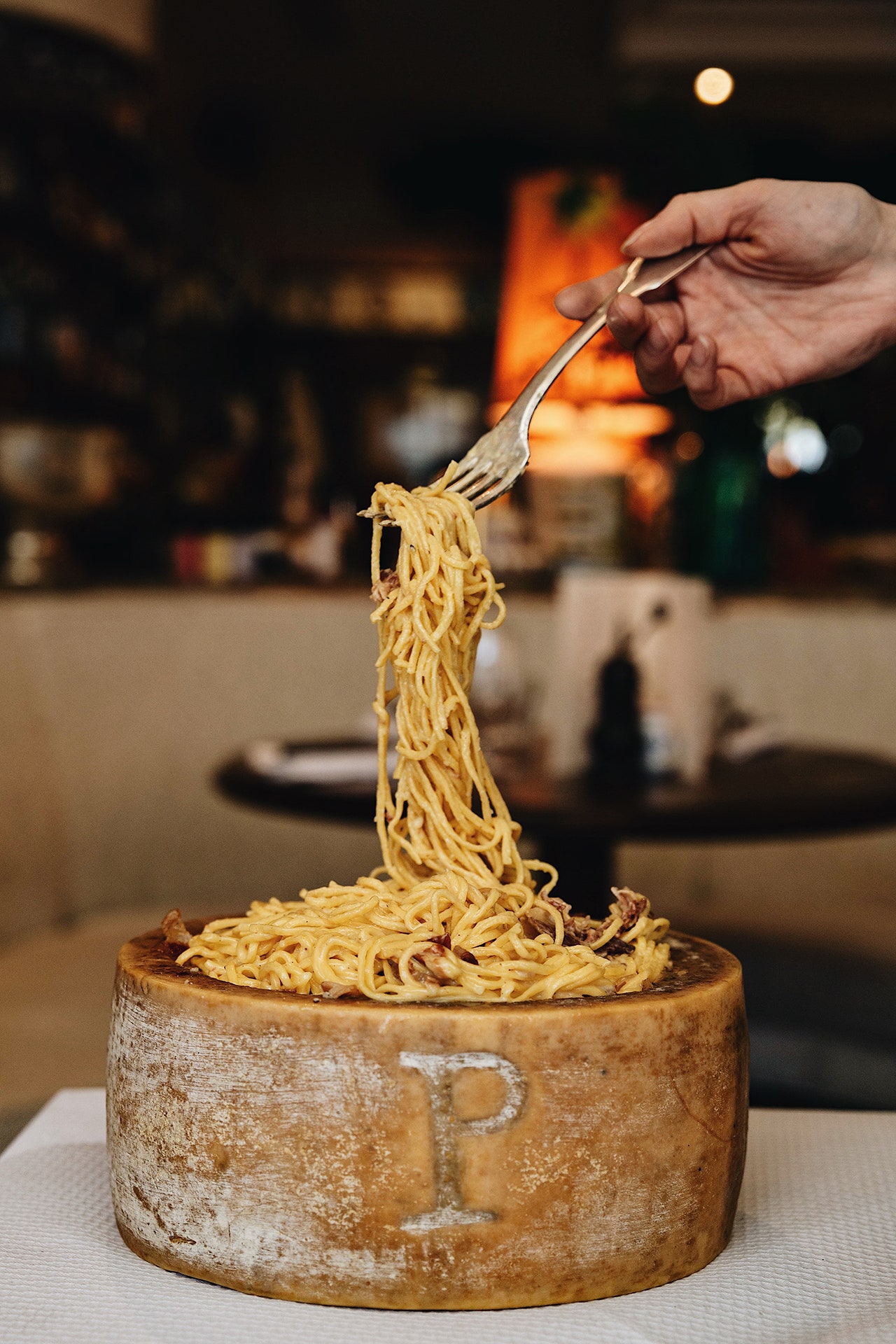 Image may contain Food Noodle Pasta Human Person Wedding Cake Dessert and Cake