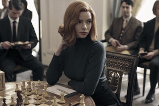 Image may contain Human Person Anya TaylorJoy Chess Game Suit Coat Clothing Overcoat Apparel Tie and Accessories
