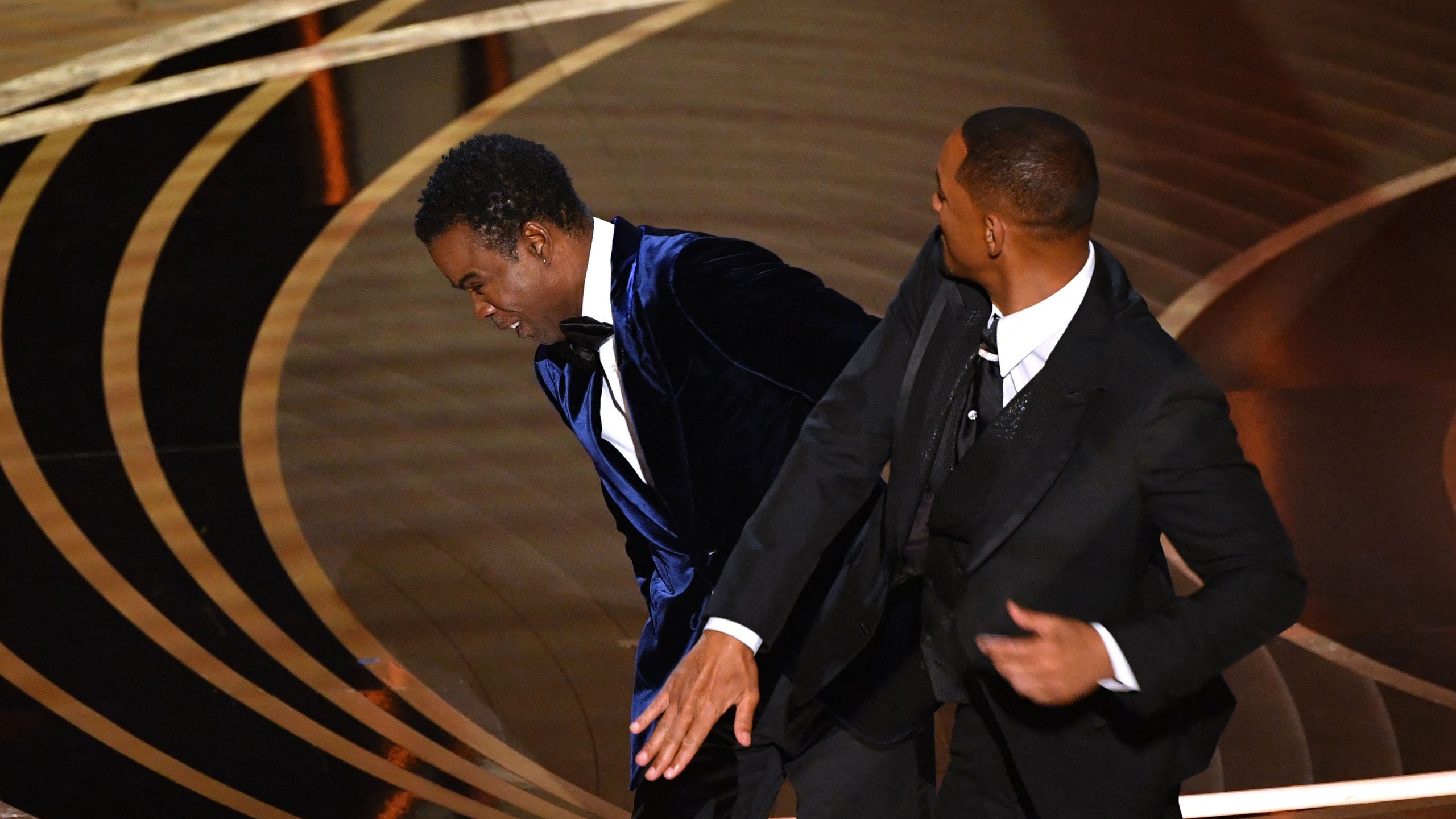 TOPSHOT  US actor Will Smith  slaps US actor Chris Rock onstage during the 94th Oscars at the Dolby Theatre in Hollywood...