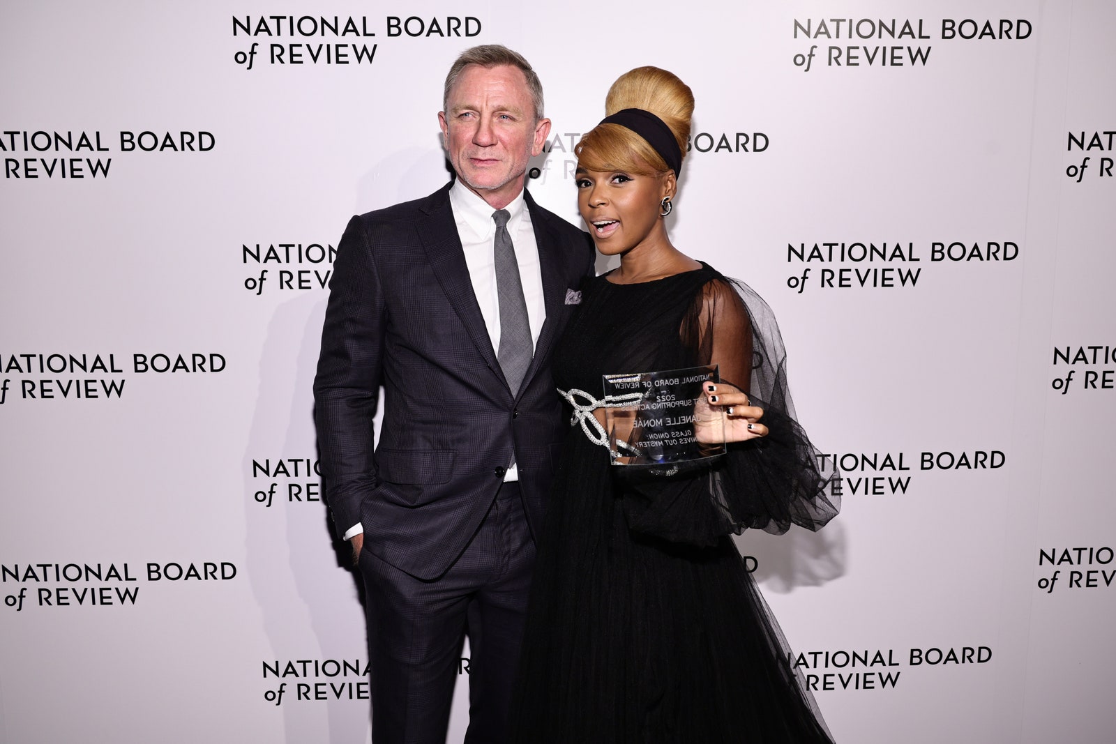 NEW YORK NEW YORK  JANUARY 08 Daniel Craig presents the Best Supporting Actress award to Janelle MonÃ¡e for â€œGlass...