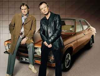 Image may contain John Simm Philip Glenister Clothing Coat Jacket Adult Person Car Transportation and Vehicle