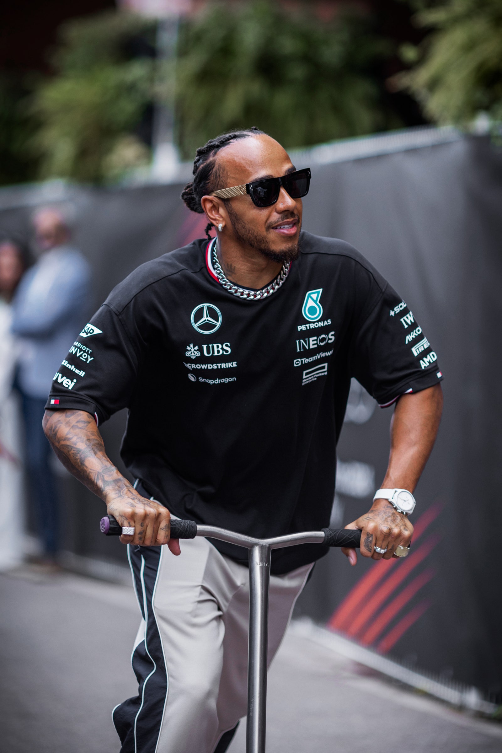 Image may contain Lewis Hamilton Wristwatch Accessories Glasses Adult Person Jewelry Ring Face Head and Necklace