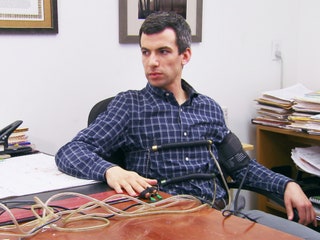 Image may contain Nathan Fielder Adult Person Face Head Photography Portrait Furniture and Table