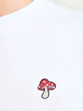 Image may contain Clothing TShirt Fungus Plant Shirt and Pattern