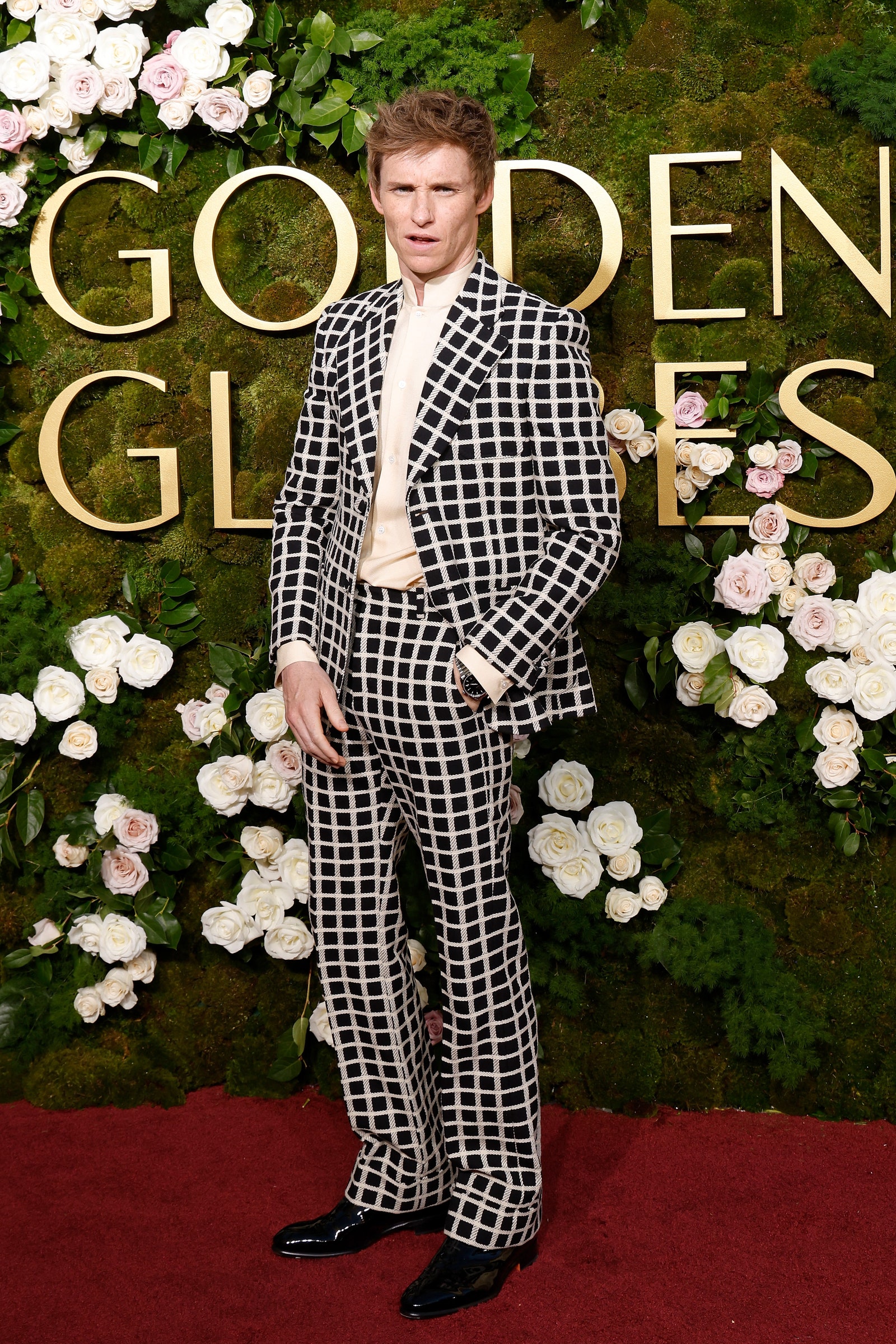 Image may contain Eddie Redmayne Clothing Formal Wear Suit Fashion Adult Person Footwear Shoe and Coat