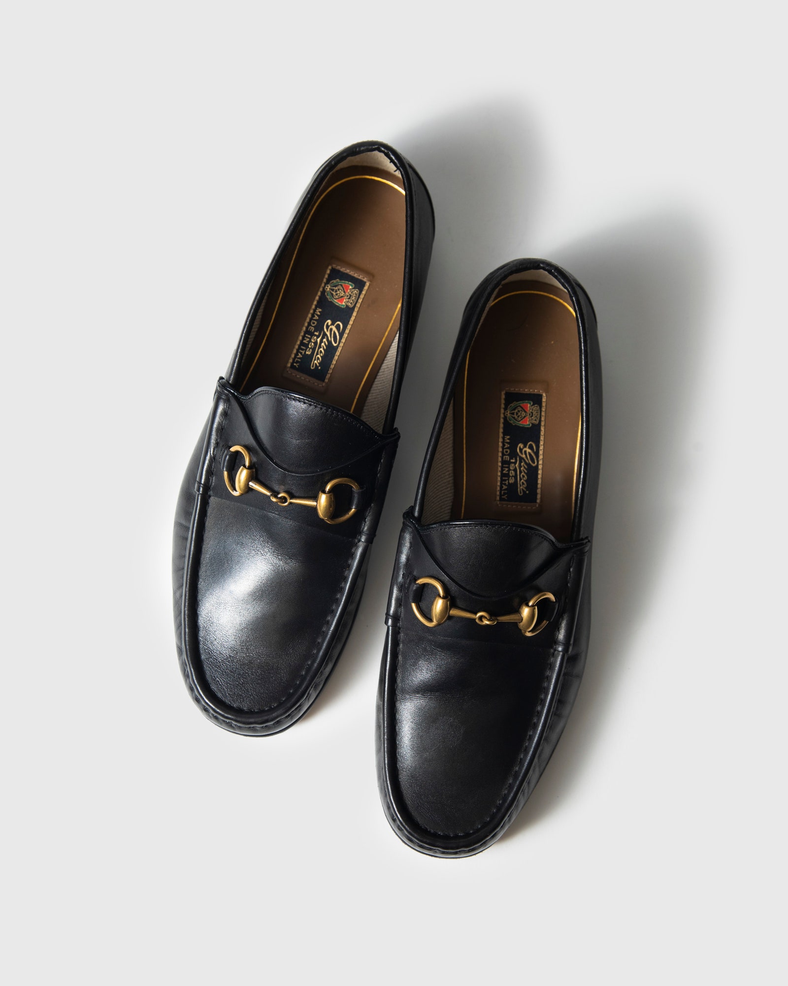 A pair of black Gucci 1953 Horsebit Leather Loafers