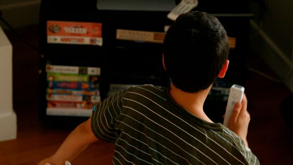 A boy using a Wii controller. 