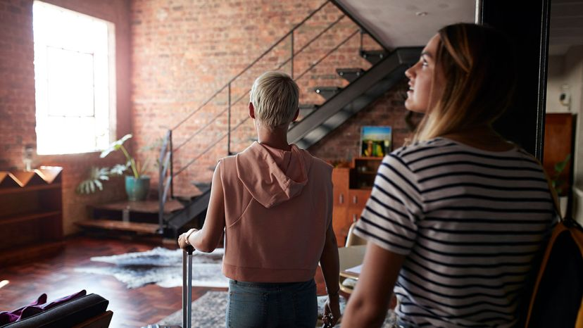 Two women arrive at a vacation rental