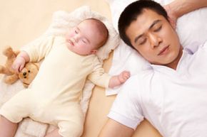 sleeping father and baby