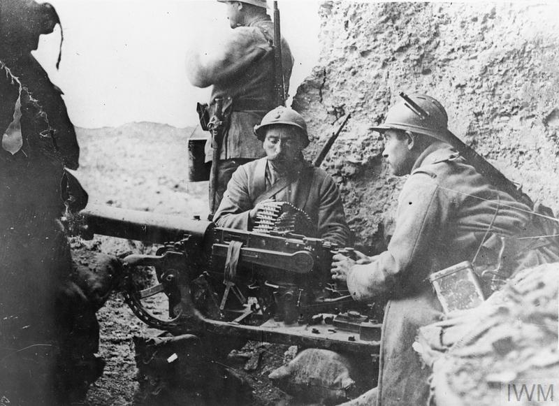 French troops manning a captured German Maxim gun at Fort Douaumont, Verdun, 1916.