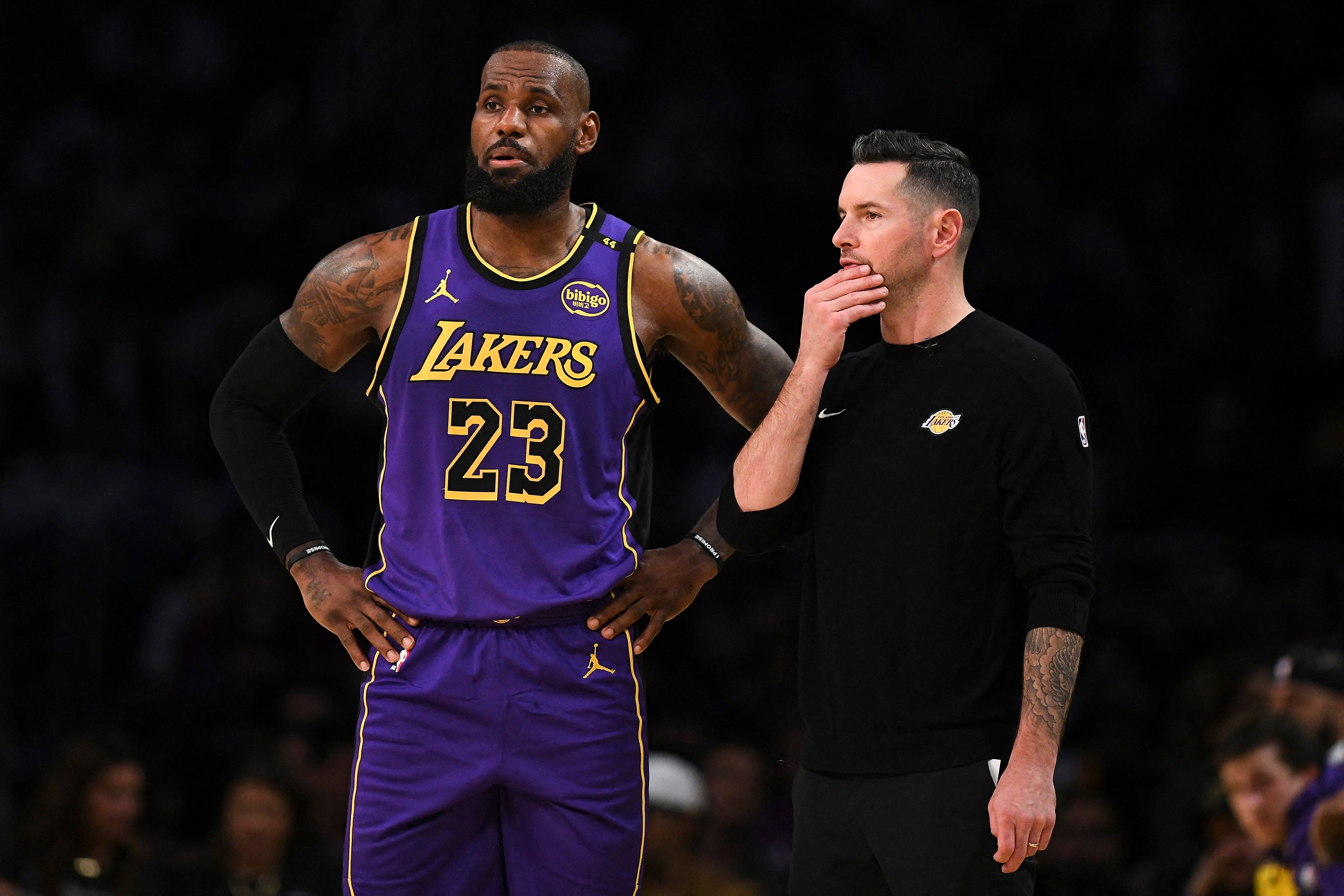 A photo of the basketball player LeBron James of the Los Angeles Lakers and J. J. Redick the teams coach.