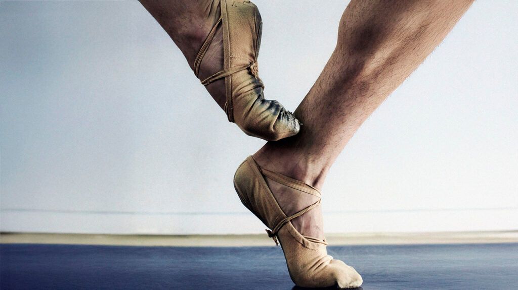 A ballet dancer balancing on their toes-2.