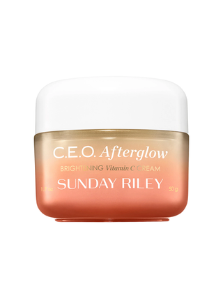 CEO Afterglow Brightening Vitamin C Cream in branded gradient coral jar with white lid on white background