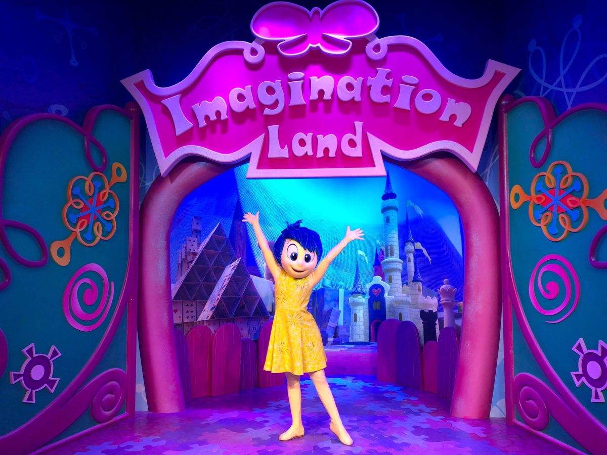 Joy in front of Imagination Land backdrop at EPCOT