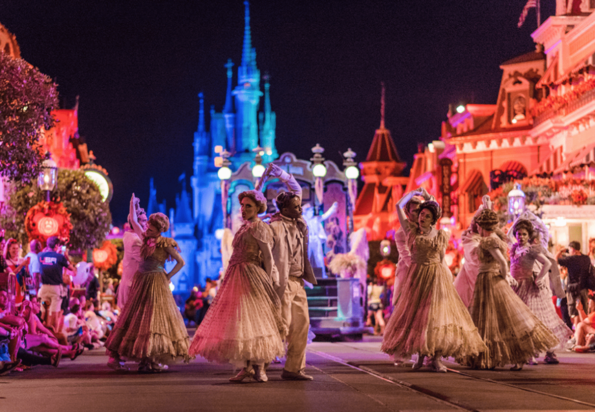 Ghost performers dance in Boo-To-You Parade in front of Cinderella Castle at Mickey's Not-So-Scary Halloween Party