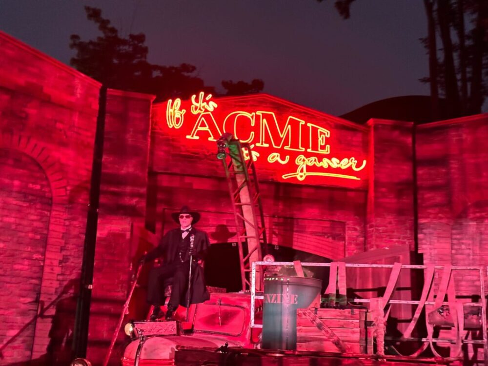 Judge Doom in red-lit scene below Acme sign