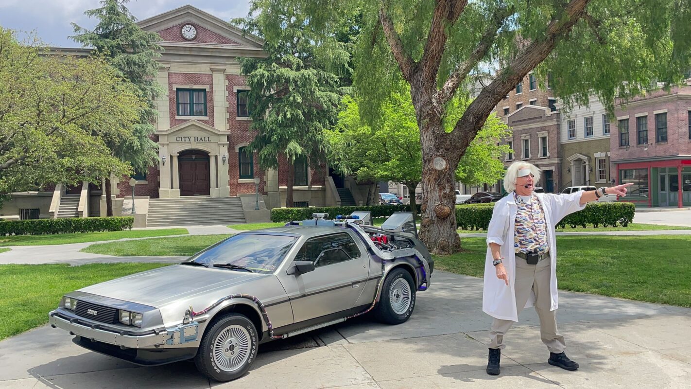 Doc Brown and DeLorean in front of clocktower City Hall
