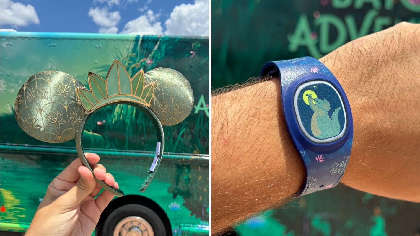 The image shows a hand holding Mickey ears with a crown, and another hand wearing a blue wristband featuring a dragon design. The background includes a green, themed vehicle.