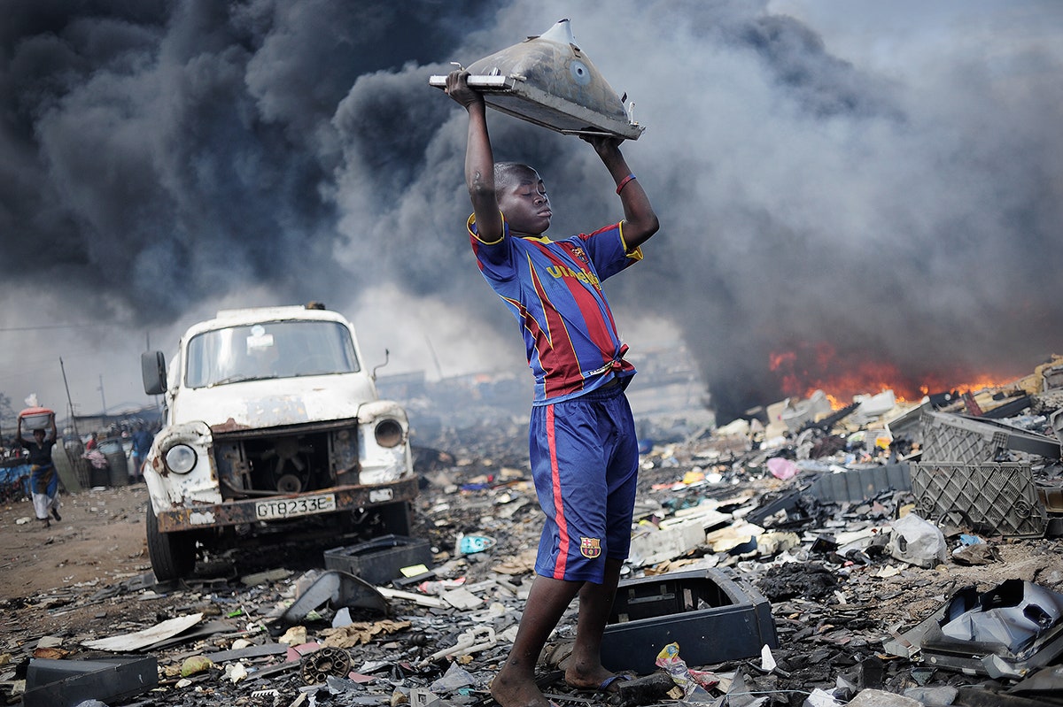 Image may contain Human Person Urban Pollution Transportation Vehicle Truck and Building