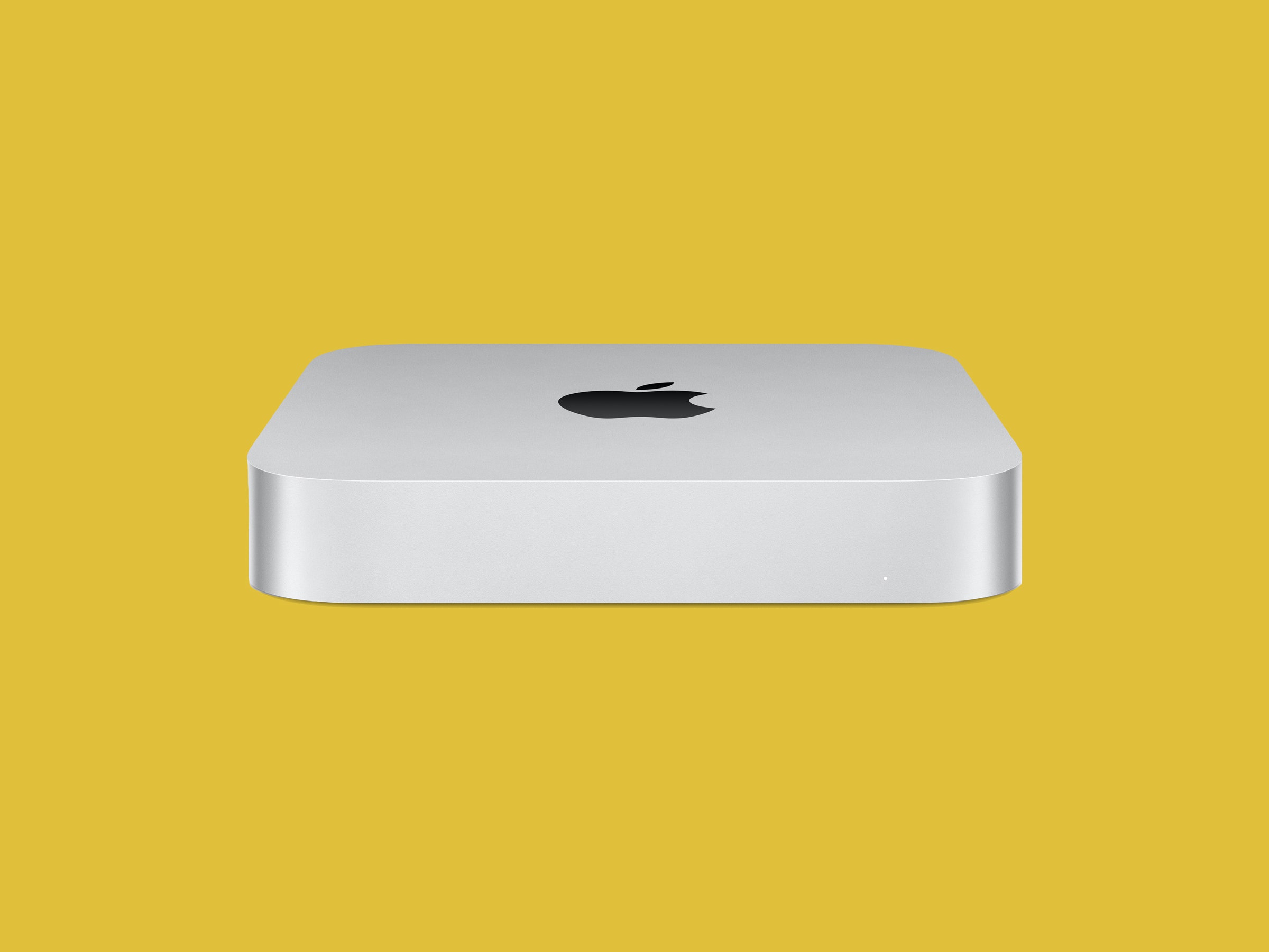 Mac Mini M2 on yellow backdrop