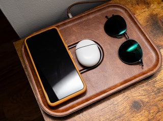 Devices charging on the Courant Mag 3 wireless charging pad