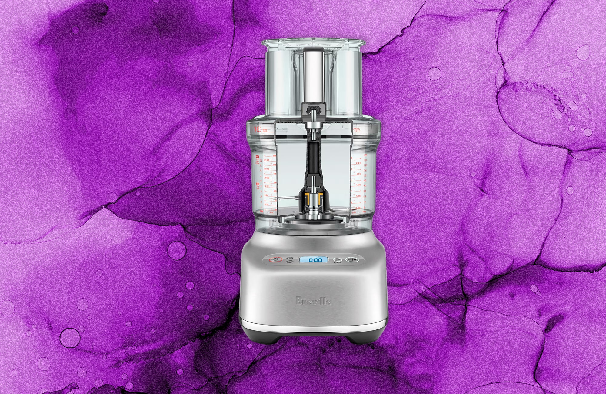 Silver food processor with large clear container and sleek base. Decorative background purple ink.