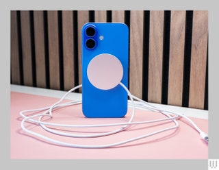 Blue mobile phone case with silver disc in the center with a cord coming from it