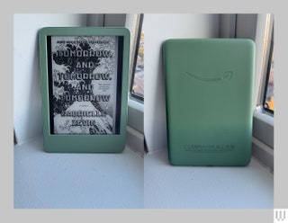 The Kindle Basic a green ereader. Left The black and white cover of an ebook on the screen. Right The green backside...