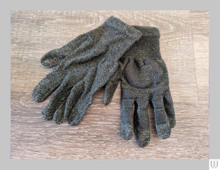 Glider Gloves in grey with textured fingertips draped on top of each other