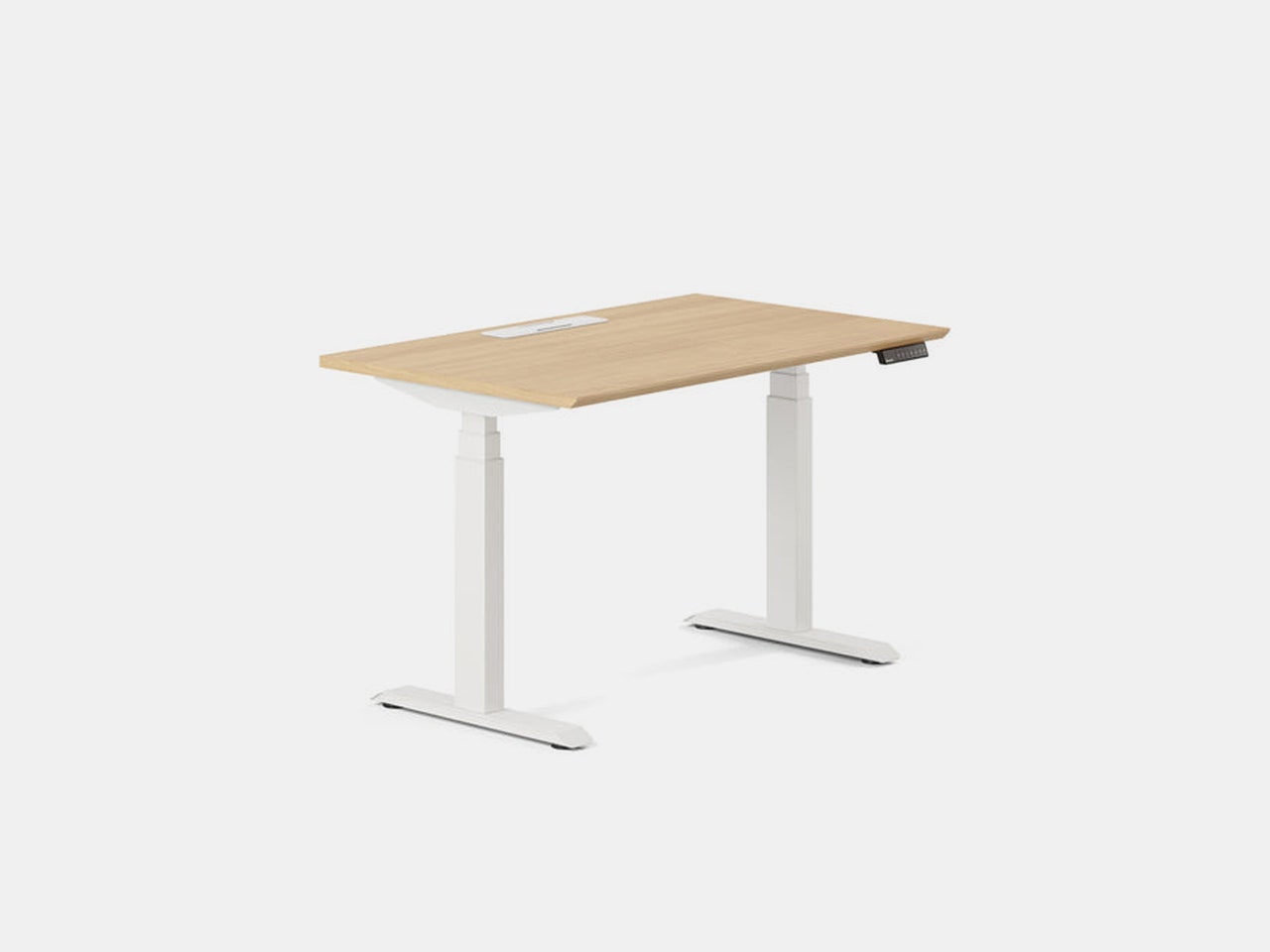 Branch Standing desk with white legs, a light brown wooden top. and small horizontal panel of buttons