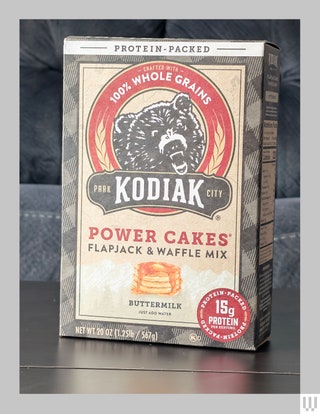 Kodiak Power Cakes Flapjack and Waffle Mix a box of mix with a bear wheat and plaid pattern on the packaging