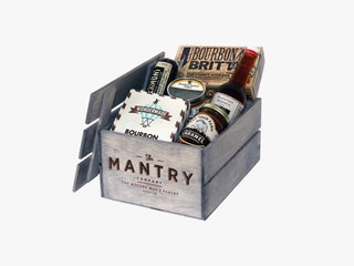 Mantry Food Subscription Box a grey crate with bottles cans and boxes of food