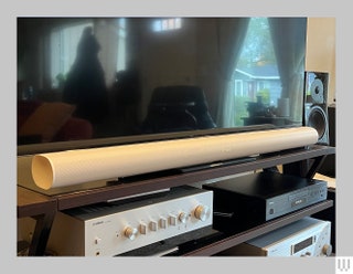 Sonos Arc Ultra Soundbar a long white speaker below a flat screen tv