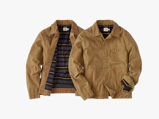 Huckberry Waxed Trucker Jacket in a tan color shown open to reveal the inner striped pattern and closed