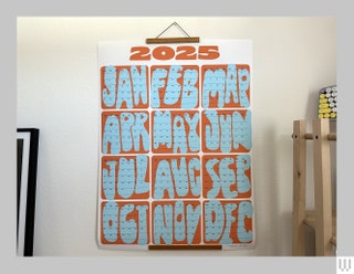 Studio Tigress Months Calendar a wall calendar for 2025 in orange and blue