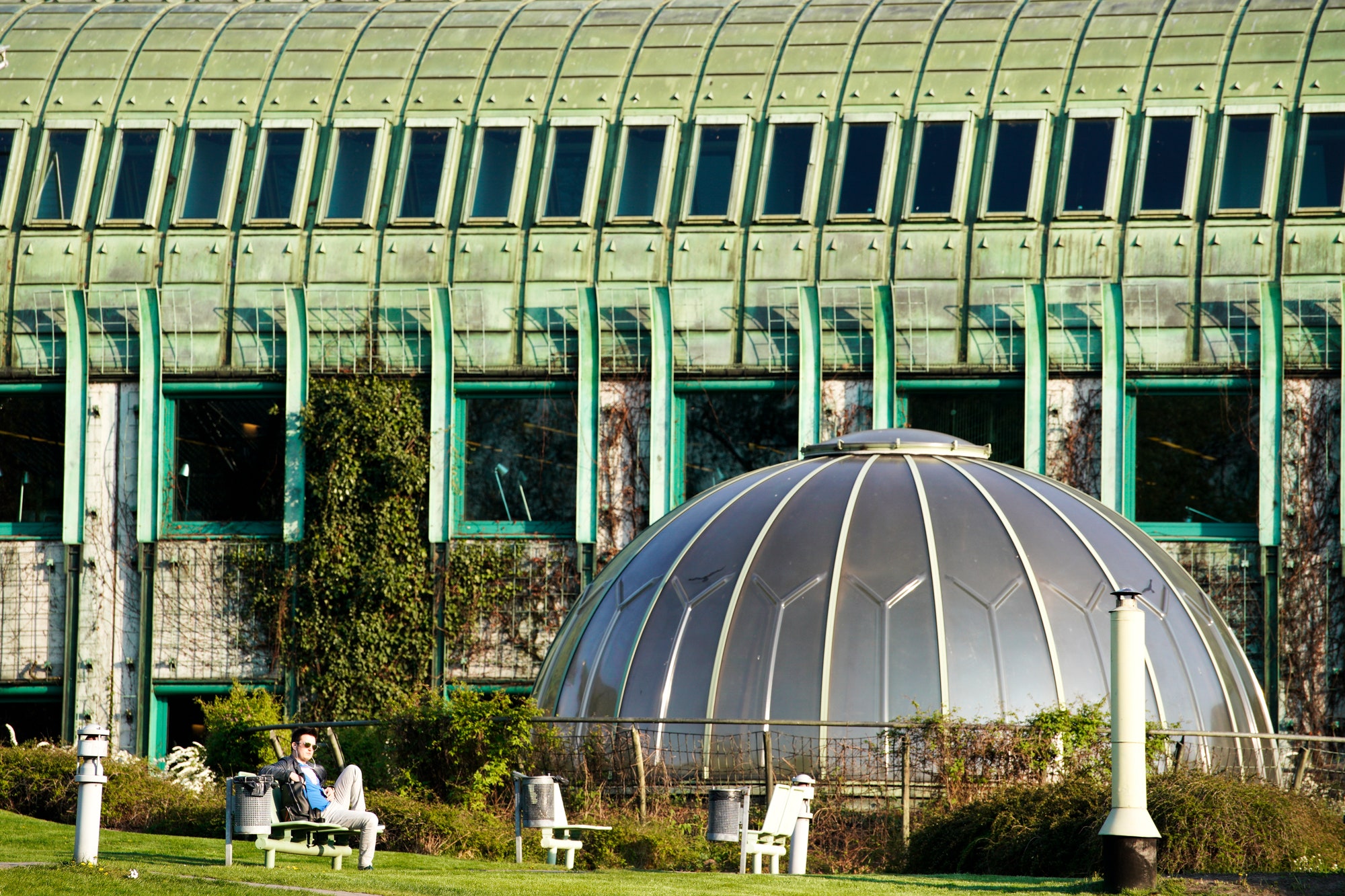 A man is seen relaxing in the gardens of the Warsaw University Library in Warsaw Poland.