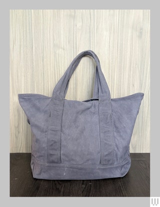 Cozy Earth Waxed Canvas Tote a faded blue bag with large handles