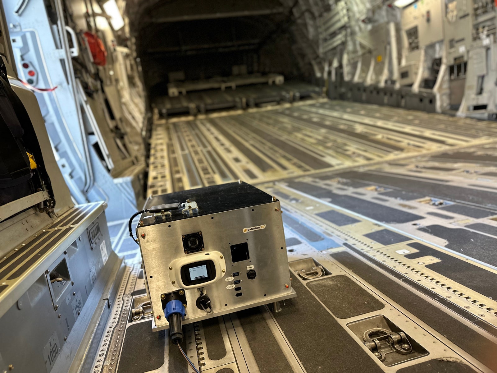 AQNav technology from SandboxAQ  mounted on the interior of a C17 military plane.