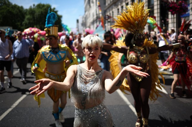 Members of the Lesbian, Gay, Bisexual and Transgender (LGBT+) community take part in the annual Pride Parade in the streets of London on June 29, 2024. (Photo by HENRY NICHOLLS / AFP) (Photo by HENRY NICHOLLS/AFP via Getty Images)